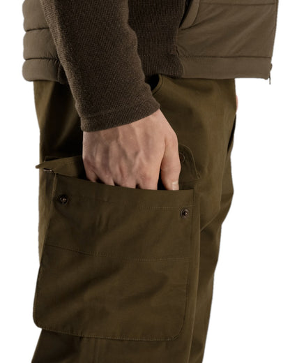 Warm Olive Coloured Harkila Retrieve Trousers on white background 