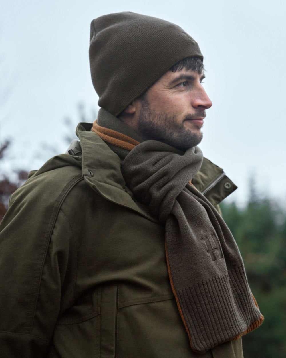 Shadow Brown Rustique Clay Coloured Harkila Reversible Beanie on outdoor background 