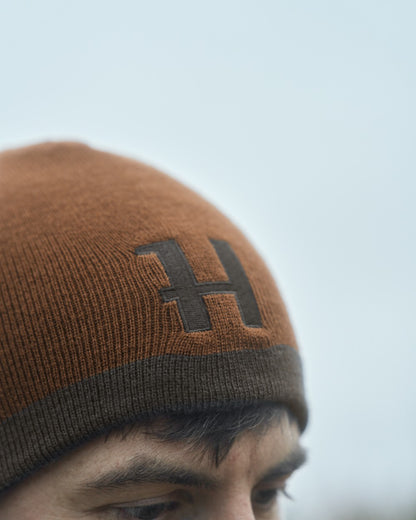 Shadow Brown Rustique Clay Coloured Harkila Reversible Beanie on outdoor background 