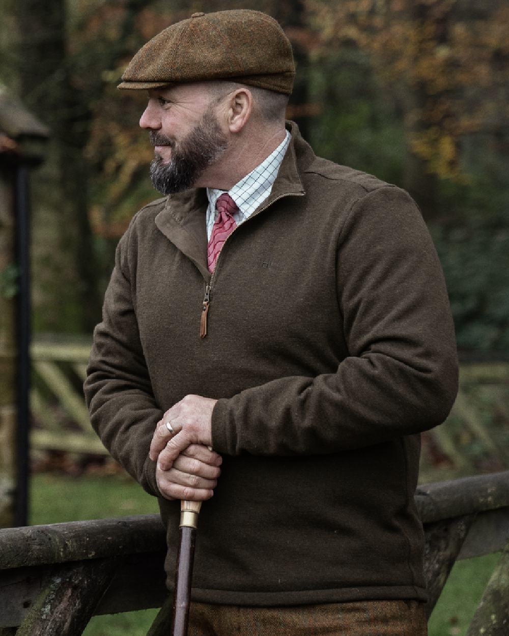 Willow Green Coloured Harkila Sandhem 200 Fleece Pullover on forest background 