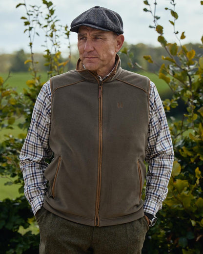 Grape Leaf Coloured Harkila Sandhem 200 Fleece Waistcoat on forest background 