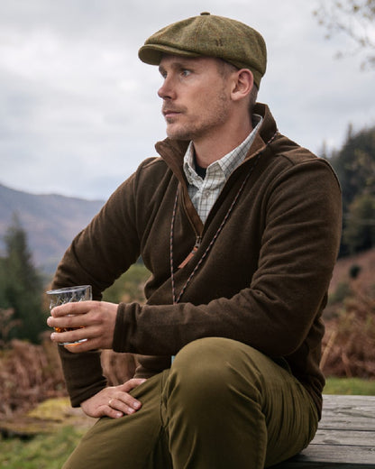 Willow Green coloured Harkila Sandhem Pro HSP Pullover on forest background 