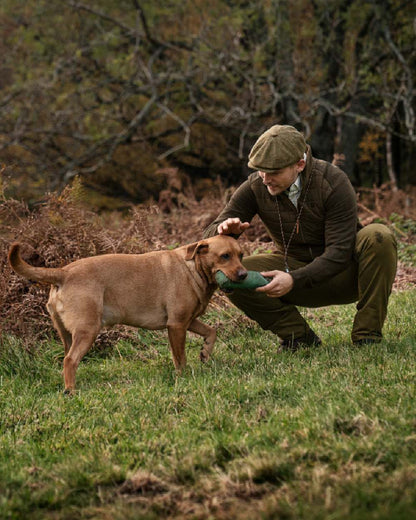 Willow Green Coloured Harkila Sandhem Pro Insulated Cardigan on forest background 