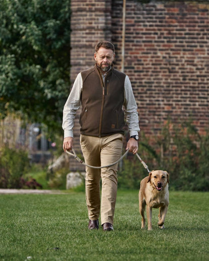 Demitasse Brown Coloured Harkila Sandhem Sherpa Fleece Waistcoat on backyard background 