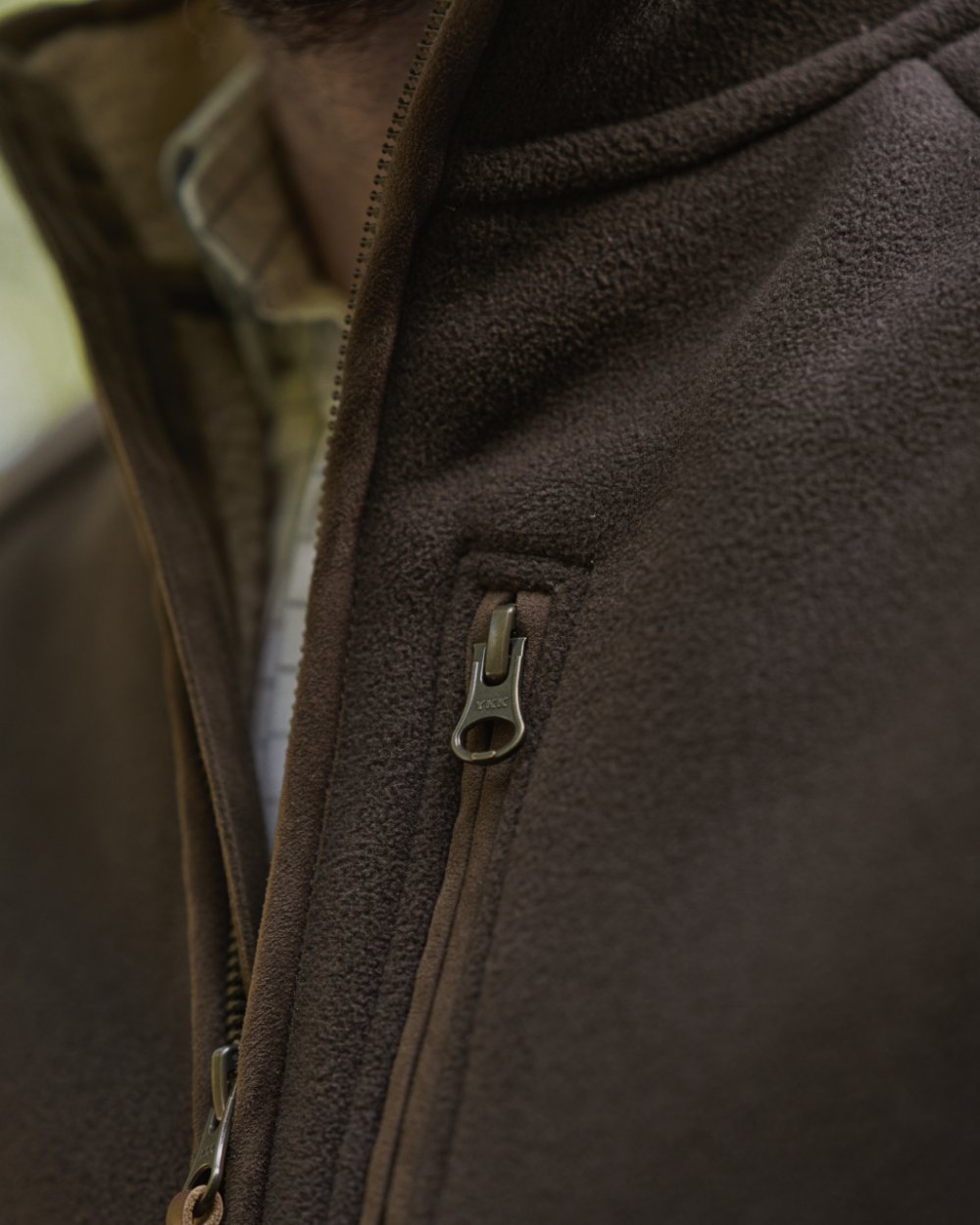 Demitasse Brown Coloured Harkila Sandhem Sherpa Fleece Waistcoat on outdoor background 