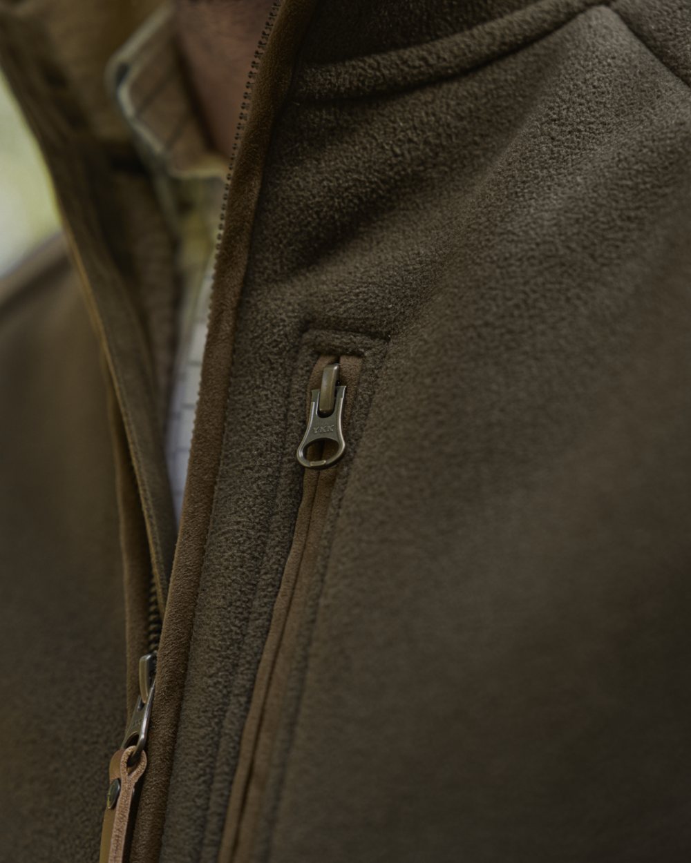 Willow Green Coloured Harkila Sandhem Sherpa Fleece Waistcoat on outdoor background 