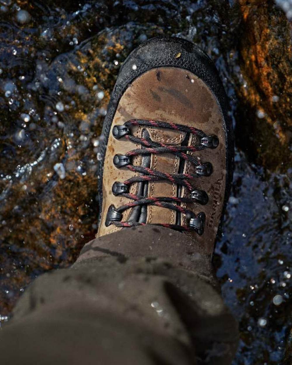 Mid Brown Coloured Harkila Saxnas Womens GTX Boots on water background 