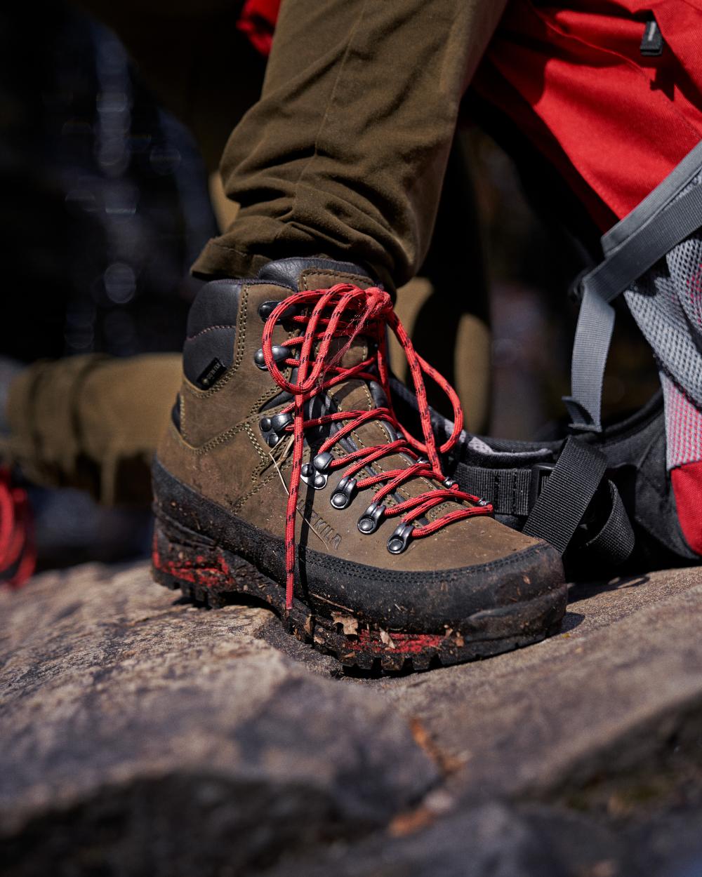 Willow Green coloured Harkila Saxnäs Womens GTX Boots on blurry background 