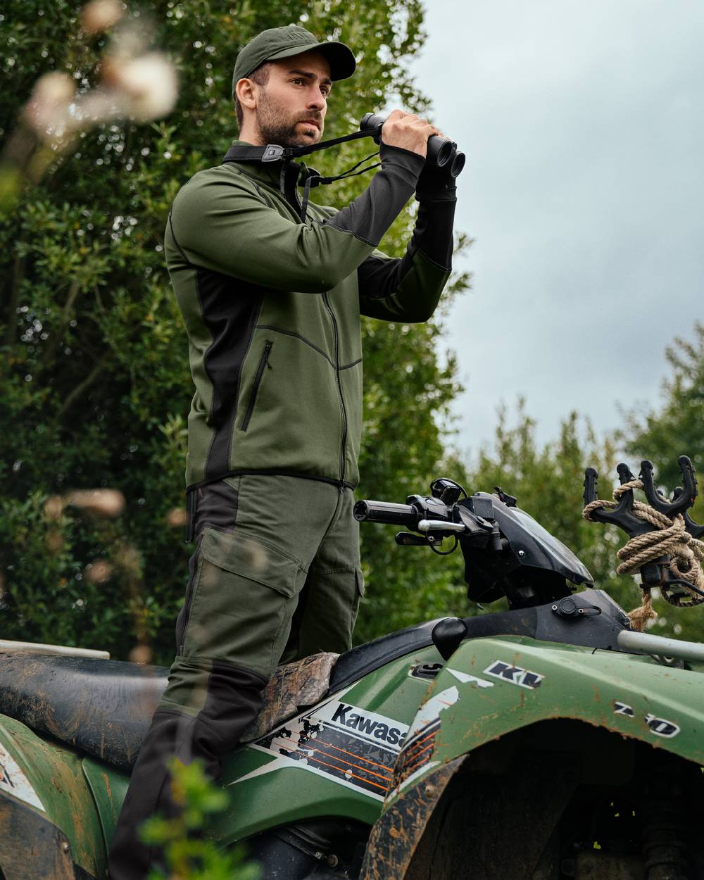 Duffel Green Black Coloured Harkila Scandinavian Fleece Jacket on outdoor background 