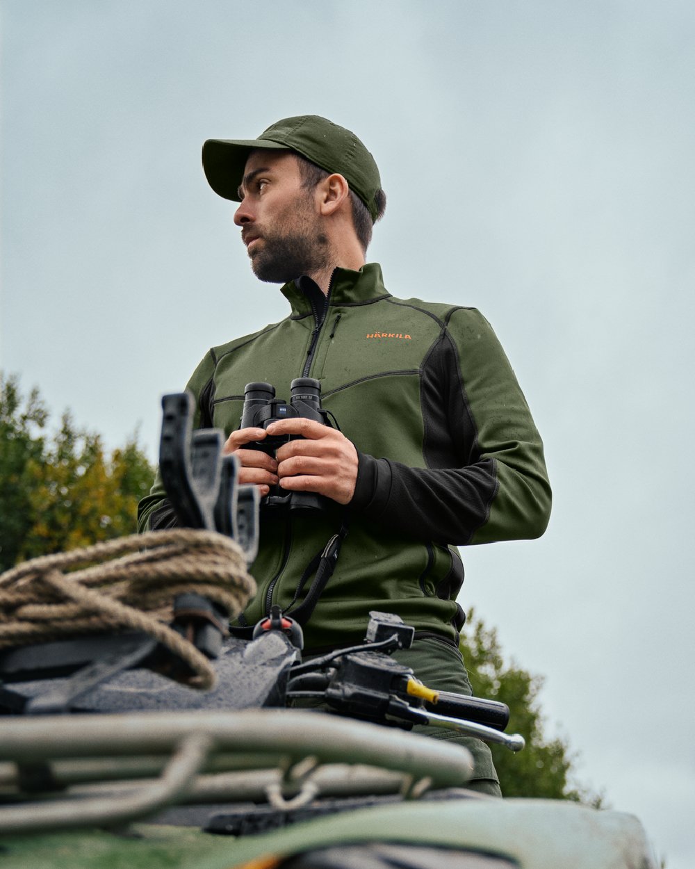 Duffel Green Black Coloured Harkila Scandinavian Fleece Jacket on outdoor background 