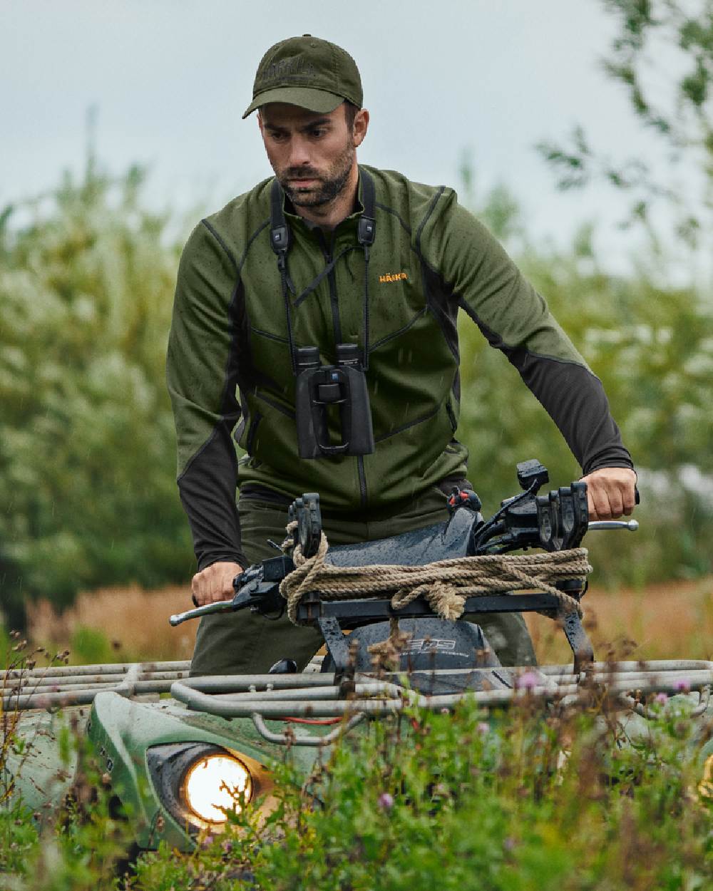 Duffel Green Black Coloured Harkila Scandinavian Fleece Jacket on outdoor background 