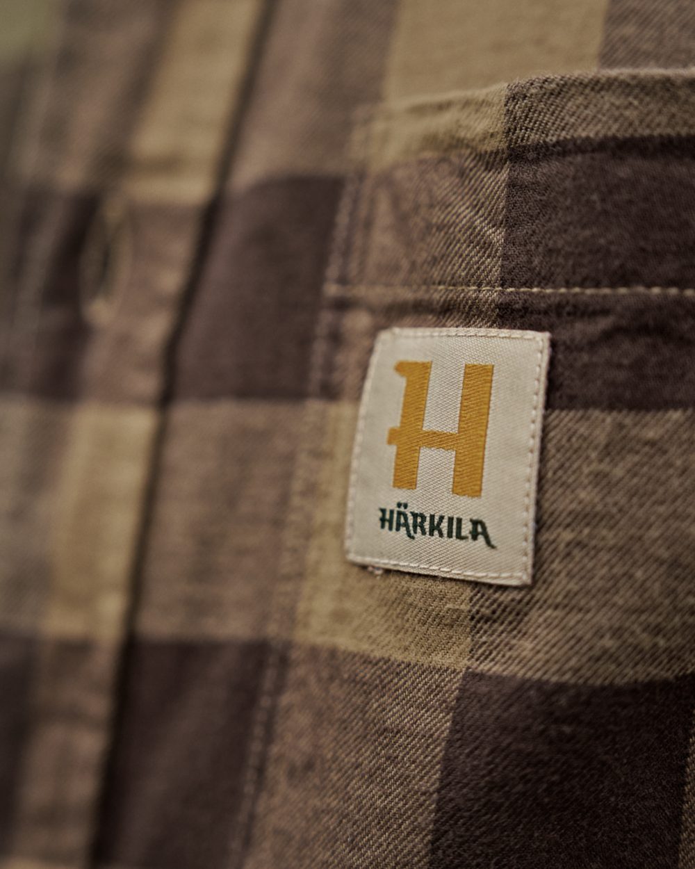 Antique Bronze Check coloured Harkila Scandinavian Long Sleeve Shirt on outdoor background 