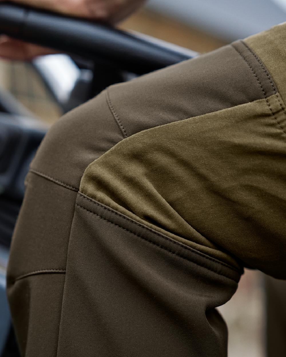 Dark Olive Willow Green Coloured Harkila Scandinavian Trousers on outdoor background 