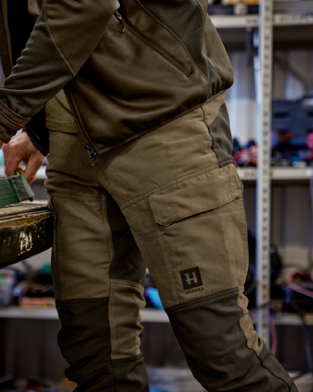 Dark Olive Willow Green Coloured Harkila Scandinavian Trousers on outdoor background 