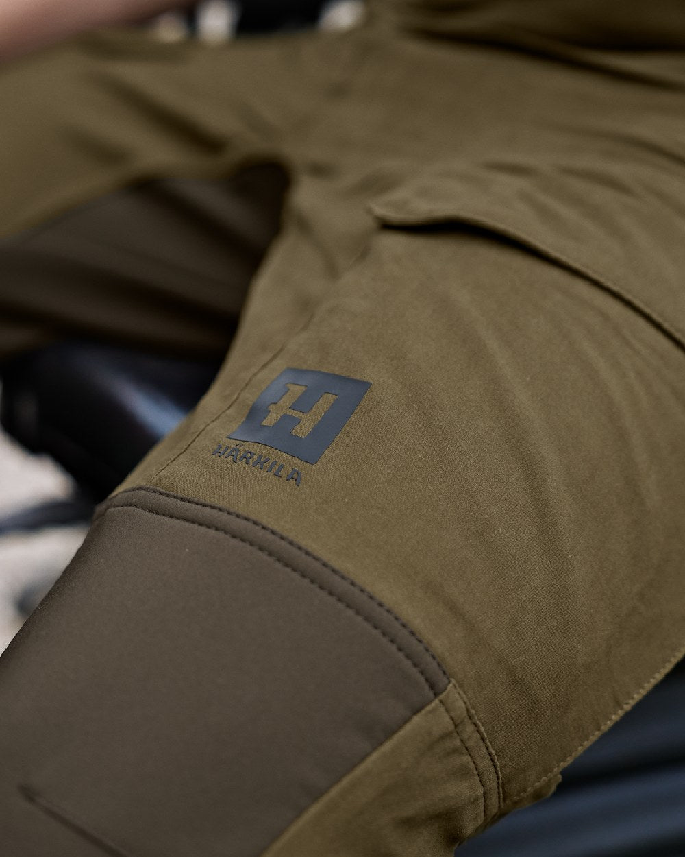 Dark Olive Willow Green Coloured Harkila Scandinavian Trousers on outdoor background 