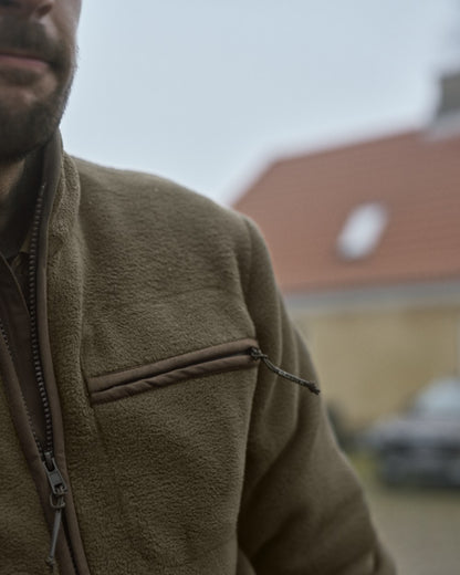 Willow Green Coloured Harkila Torsby Fleece Jacket on outdoor background 