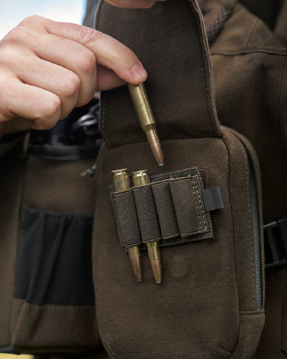 Dark Willow Green Coloured Harkila Utility Pouch on blurry background 