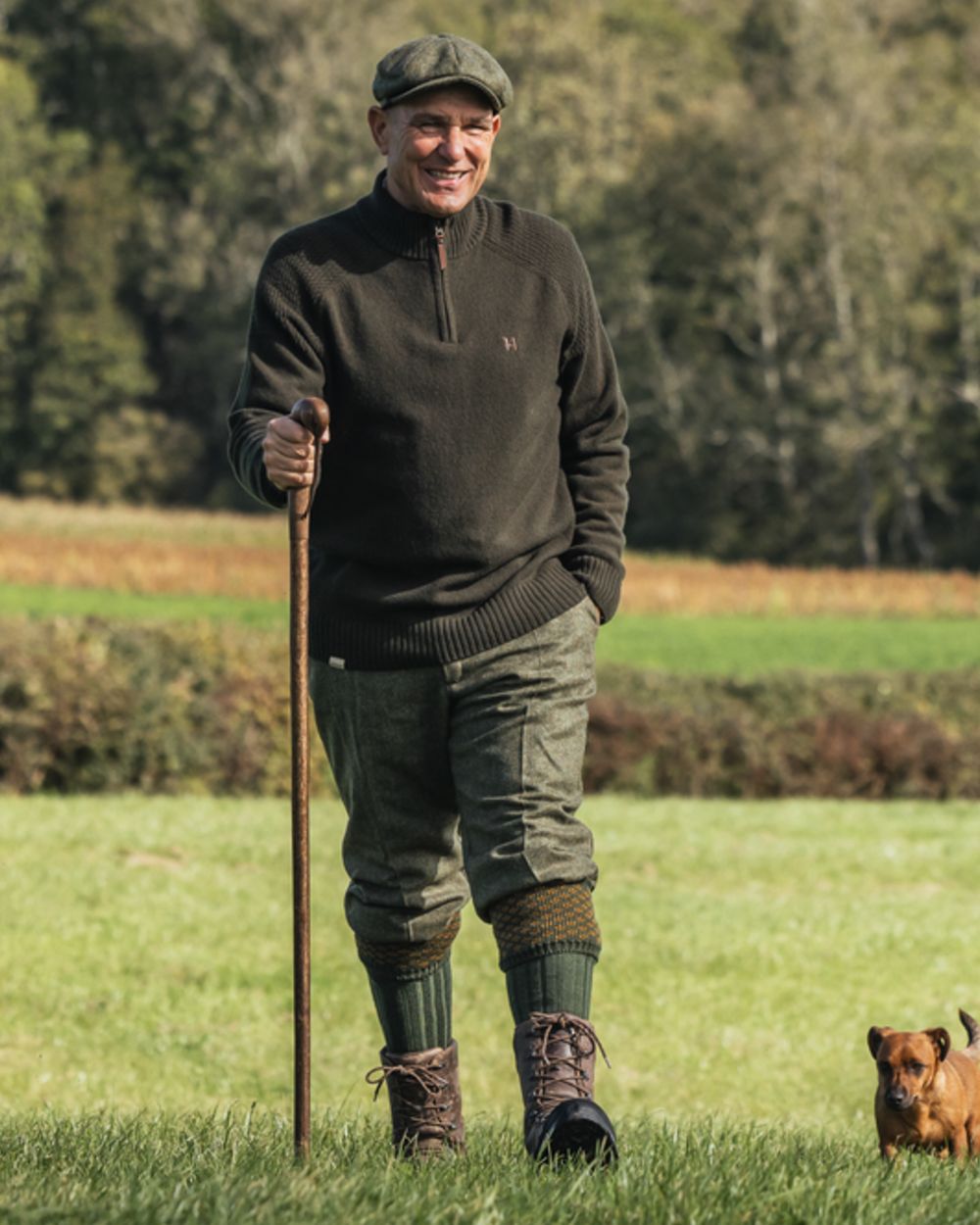 Rosin Coloured Harkila Vincent Merino Half Zip Pullover on forest background 