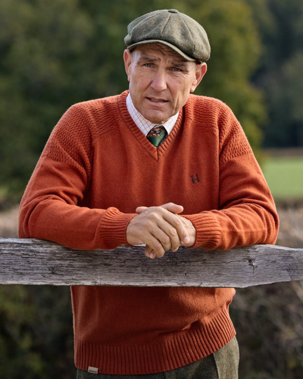 Bombay Brown Coloured Harkila Vincent Merino V-Neck Pullover on forest background 
