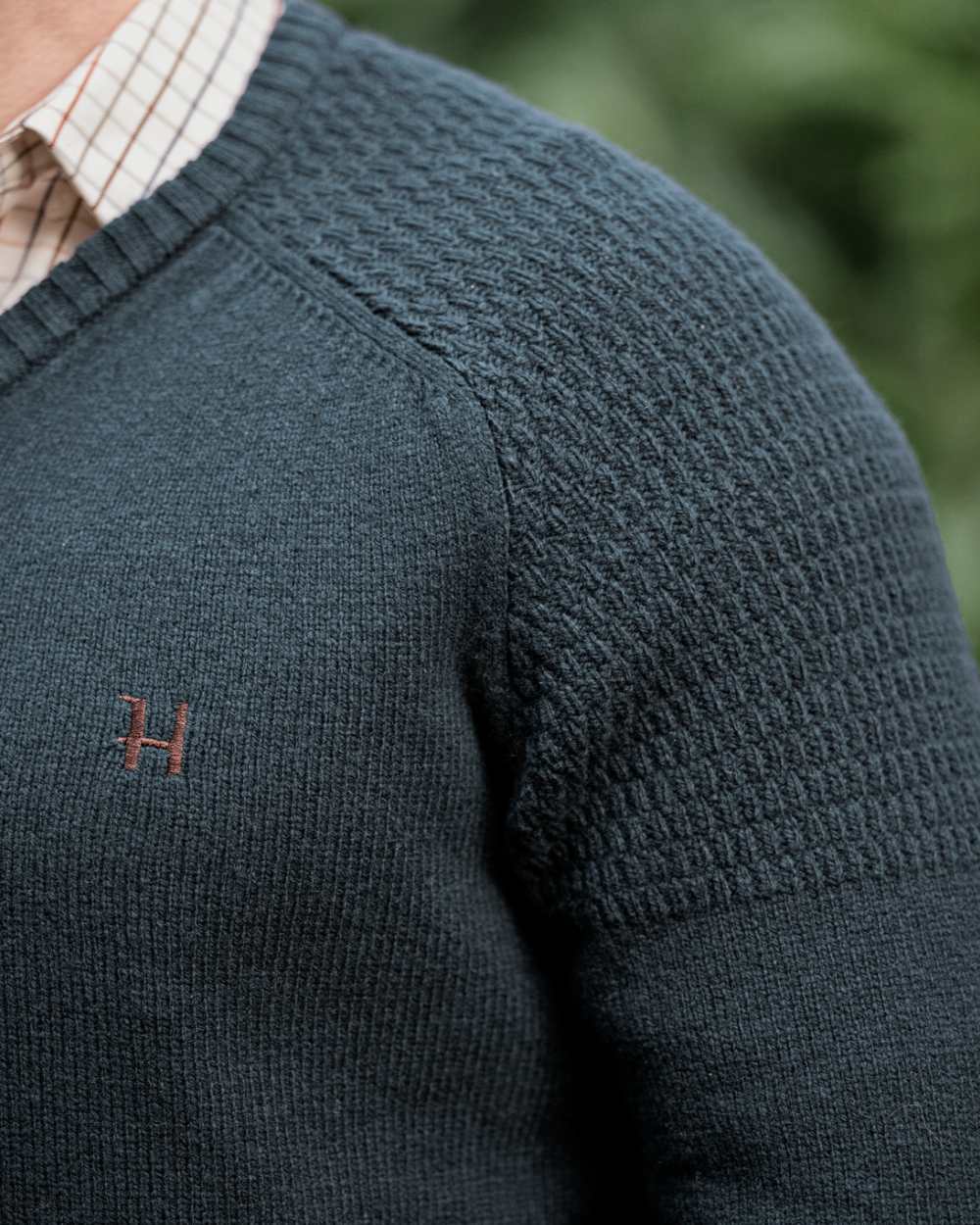 Dark Navy Coloured Harkila Vincent Merino V-Neck Pullover on forest background 