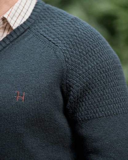 Dark Navy Coloured Harkila Vincent Merino V-Neck Pullover on forest background 