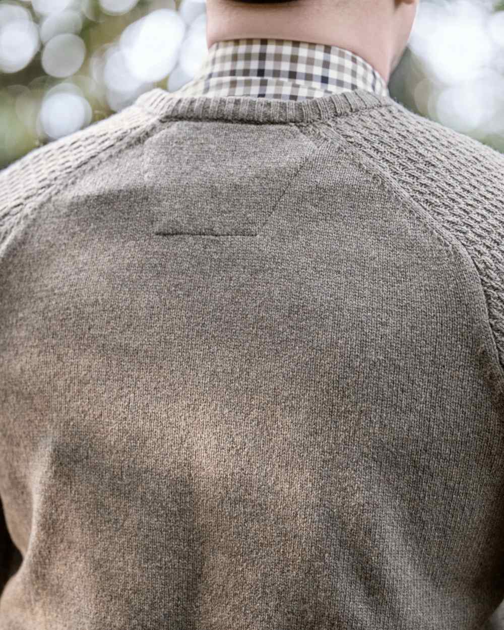 Dark Sand Coloured Harkila Vincent Merino V-Neck Pullover on forest background 