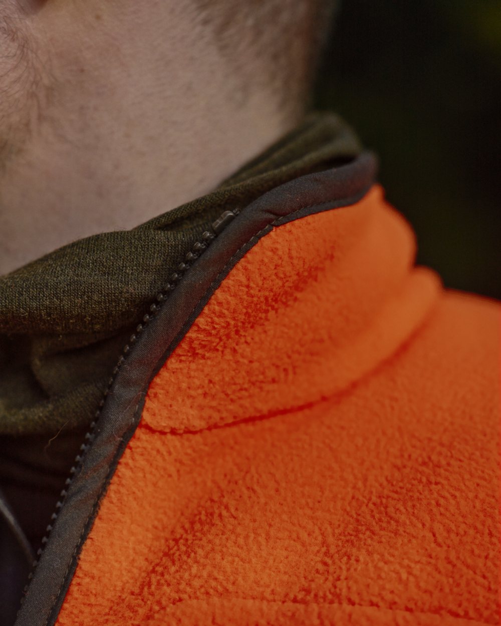 Orange Blaze Coloured Harkila Wildboar Pro Blaze Fleece Jacket on forest background 