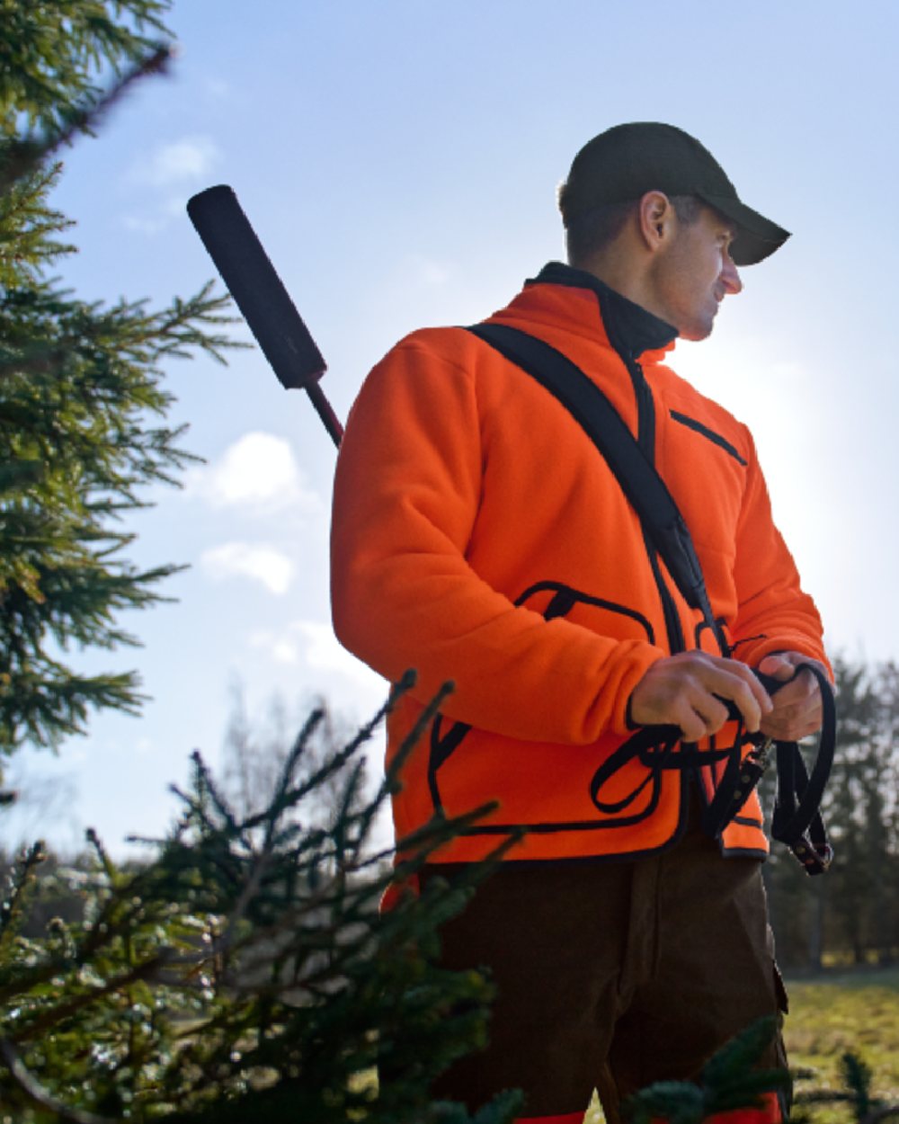 Orange Blaze Coloured Harkila Wildboar Pro Blaze Fleece Jacket on forest background 