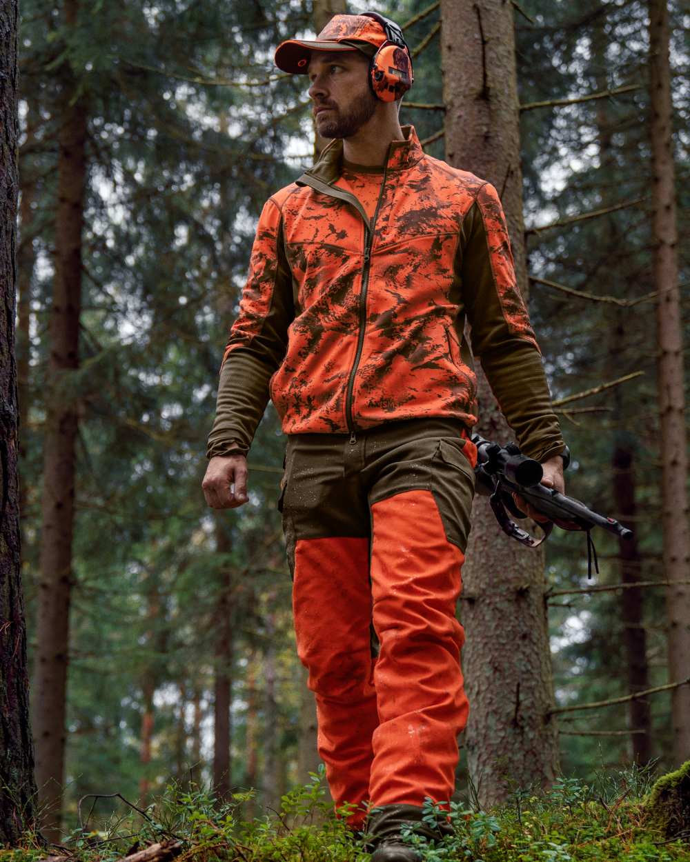 Axis Wildboar Orange Shadow Brown coloured Harkila Wildboar Pro Camo Fleece Jacket on forest background 