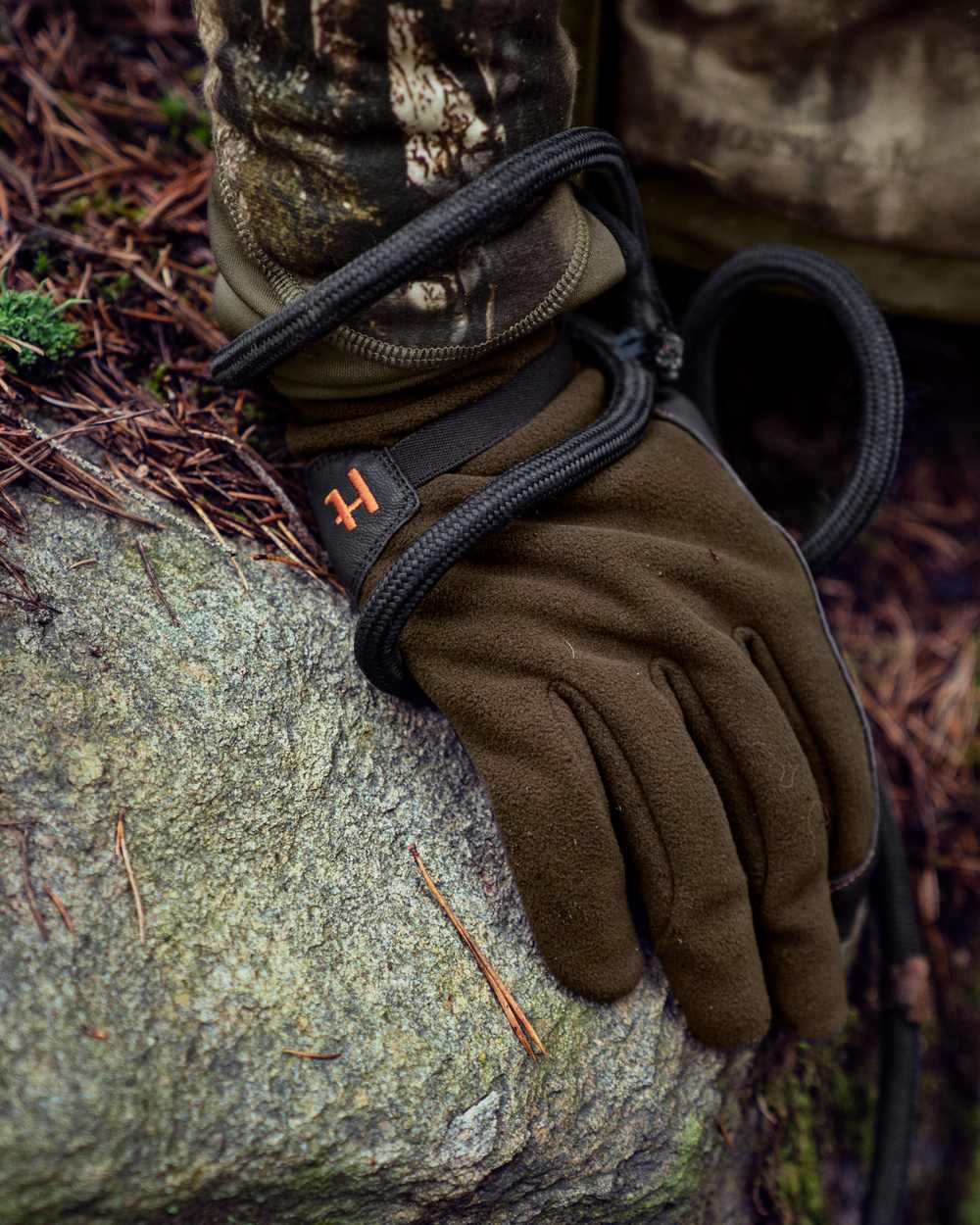 Willow Green Shadow Brown Coloured Harkila Wildboar Pro Gloves on outdoor background 