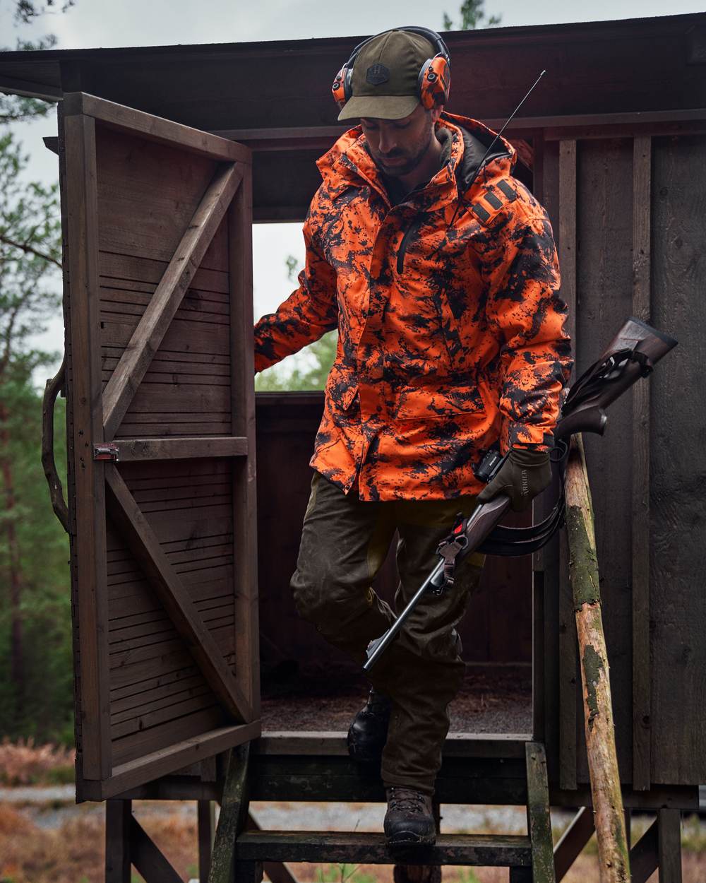AXIS Orange Blaze Coloured Harkila Wildboar Pro HWS Insulated Jacket on outdoor background 
