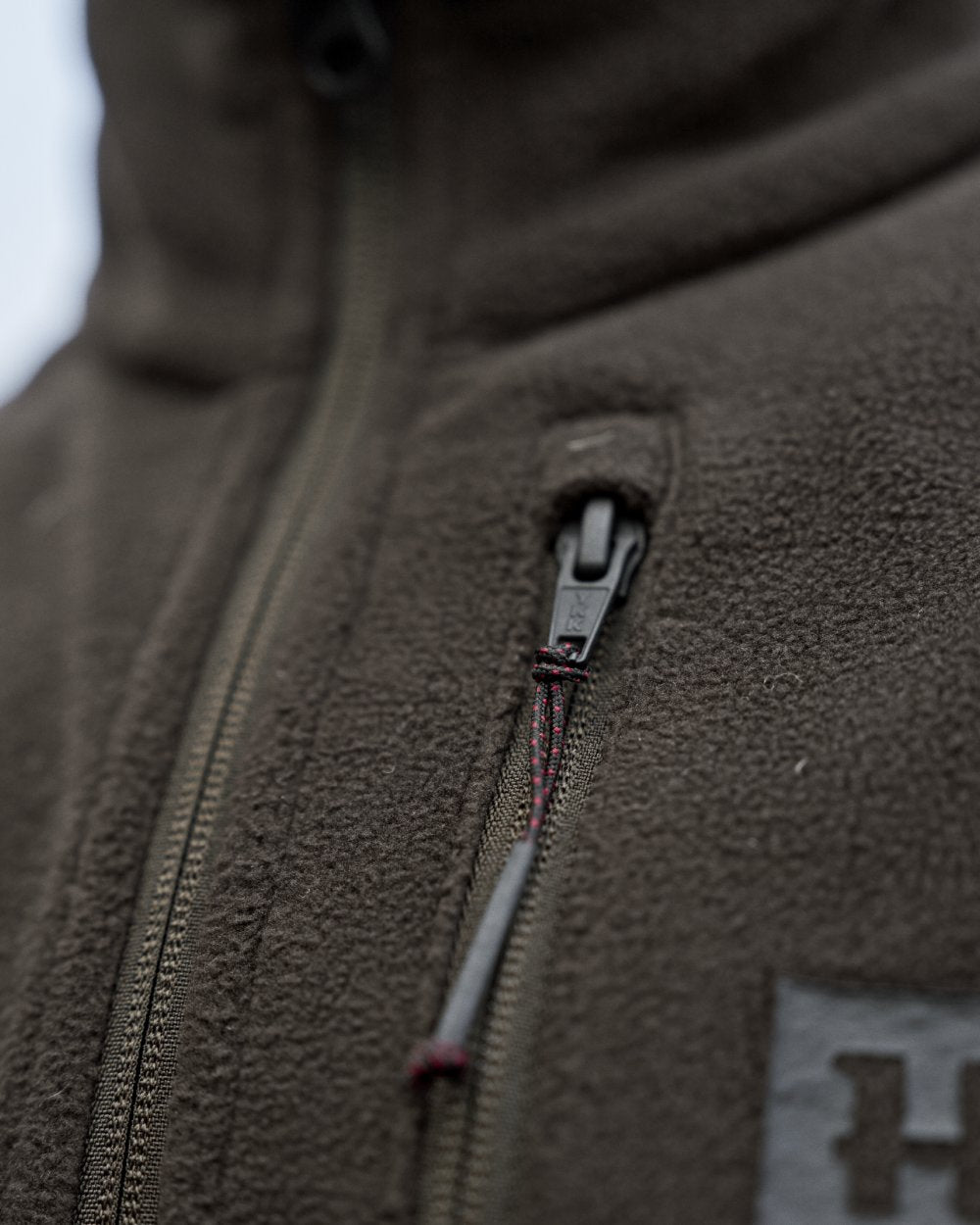 Shadow Brown Coloured Harkila Womens Aspire Fleece Waistcoat on outdoor background 