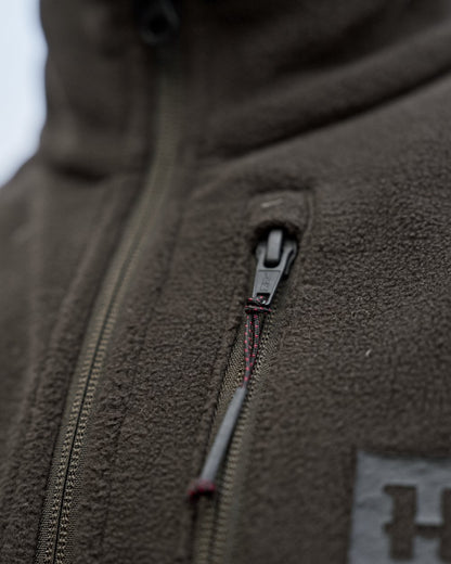 Shadow Brown Coloured Harkila Womens Aspire Fleece Waistcoat on outdoor background 