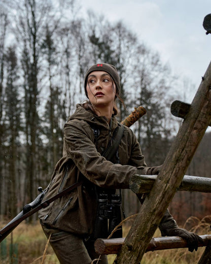 Hunting Green Coloured Harkila Womens Aspire HWS Jacket on outdoor background 