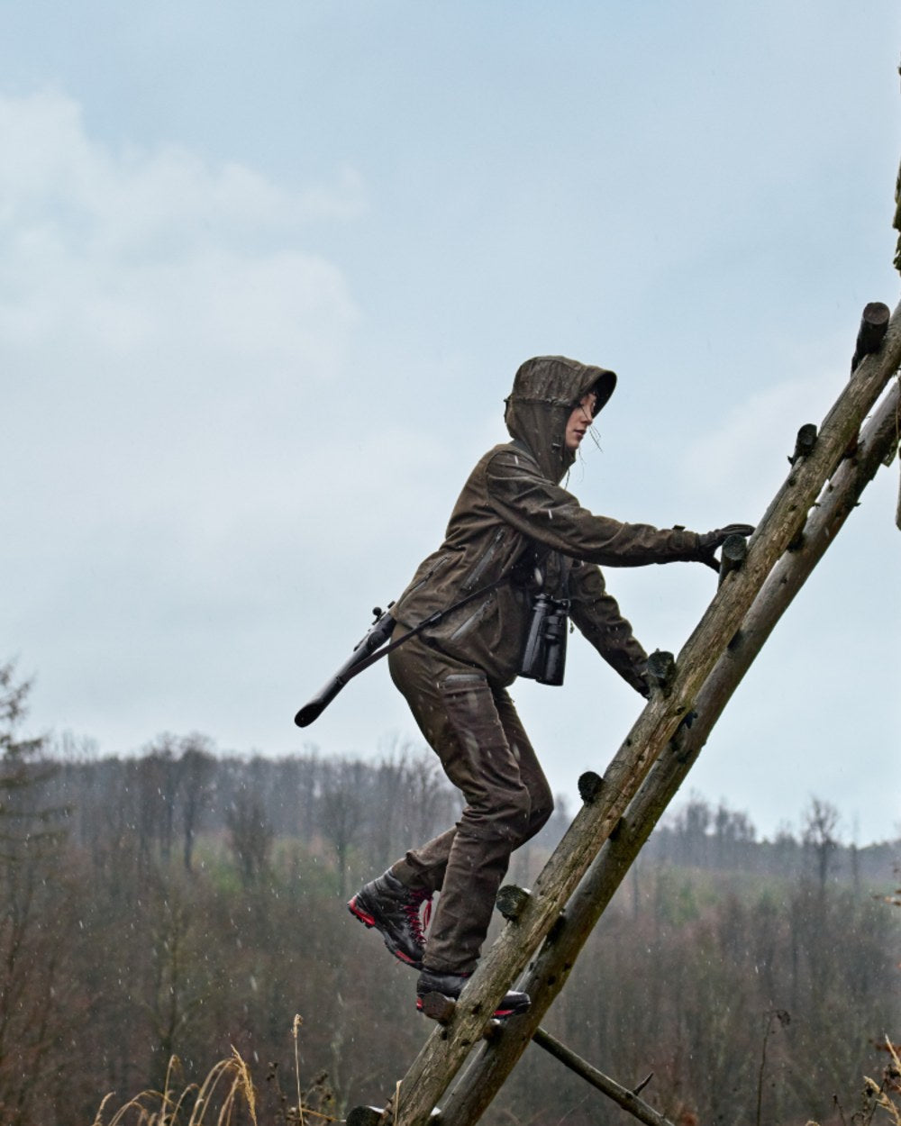 Hunting Green Shadow Brown Coloured Harkila Womens Aspire HWS Trousers on outdoor background 