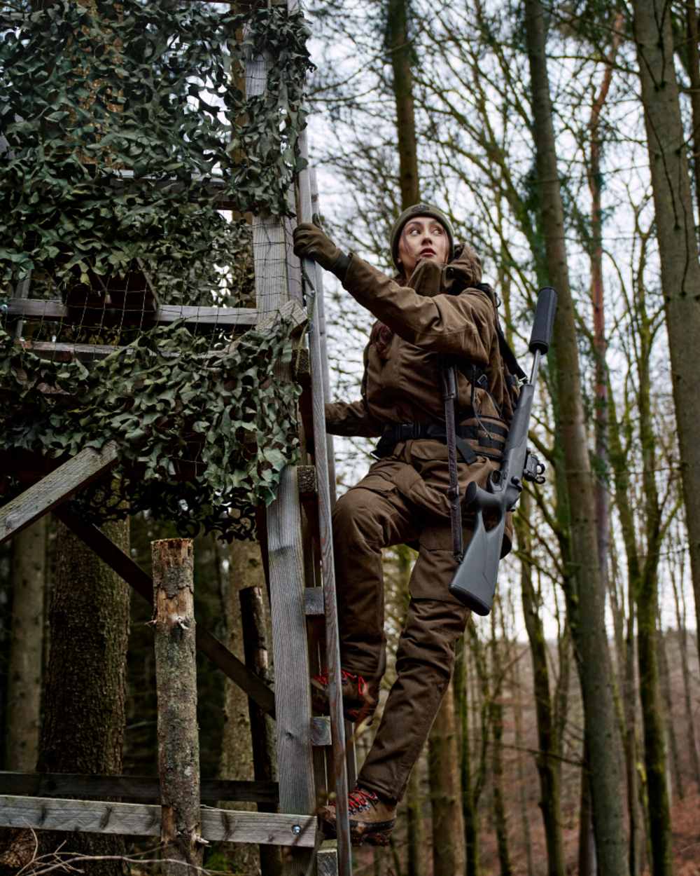 Willow Green Coloured Harkila Womens Driven Hunt HWS Insulated Jacket on forest background 