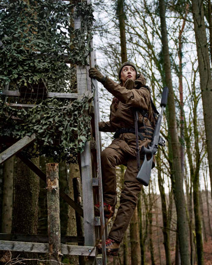 Willow Green Coloured Harkila Womens Driven Hunt HWS Insulated Jacket on forest background 