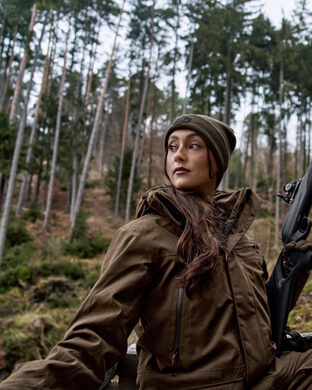 Willow Green Coloured Harkila Womens Driven Hunt HWS Insulated Jacket on forest background 