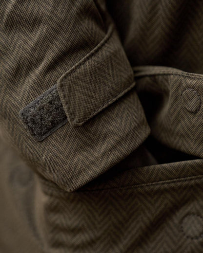 Willow Green Coloured Harkila Womens Driven Hunt HWS Insulated Jacket on forest background 