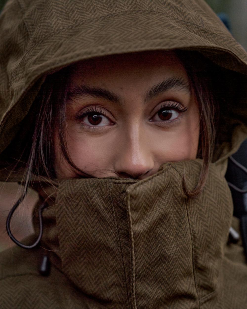 Willow Green Coloured Harkila Womens Driven Hunt HWS Insulated Jacket on forest background 