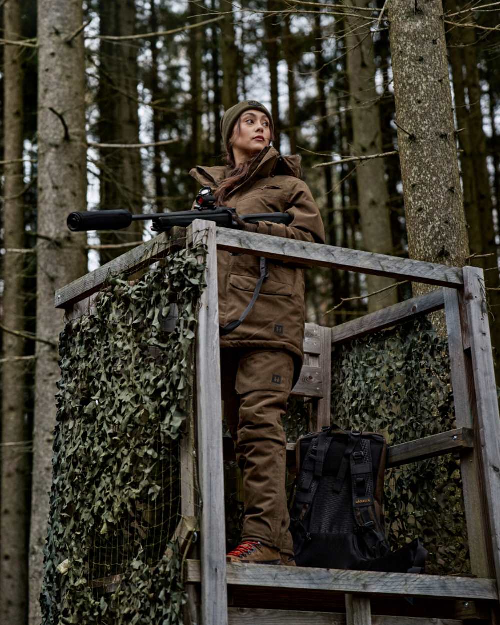 Willow Green Coloured Harkila Womens Driven Hunt HWS Insulated Jacket on forest background 