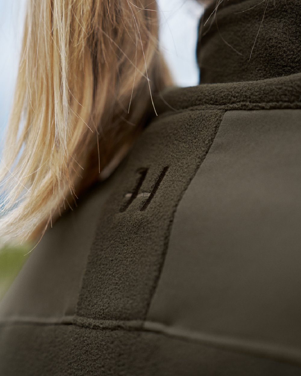 Hunting Green Willow Green Coloured Harkila Womens Fjell Fleece Jacket on blurry background 