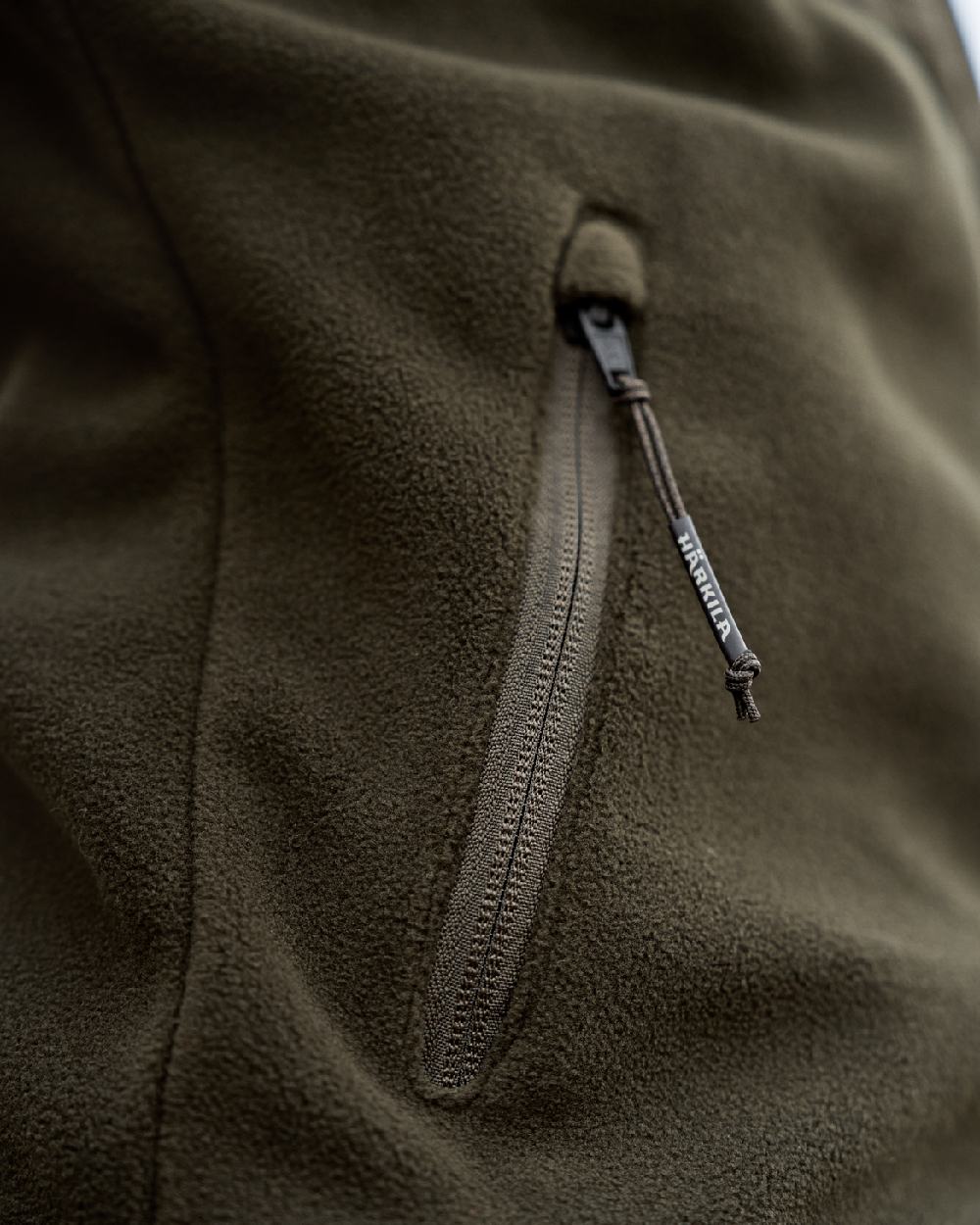Hunting Green Willow Green Coloured Harkila Womens Fjell Fleece Jacket on blurry background 