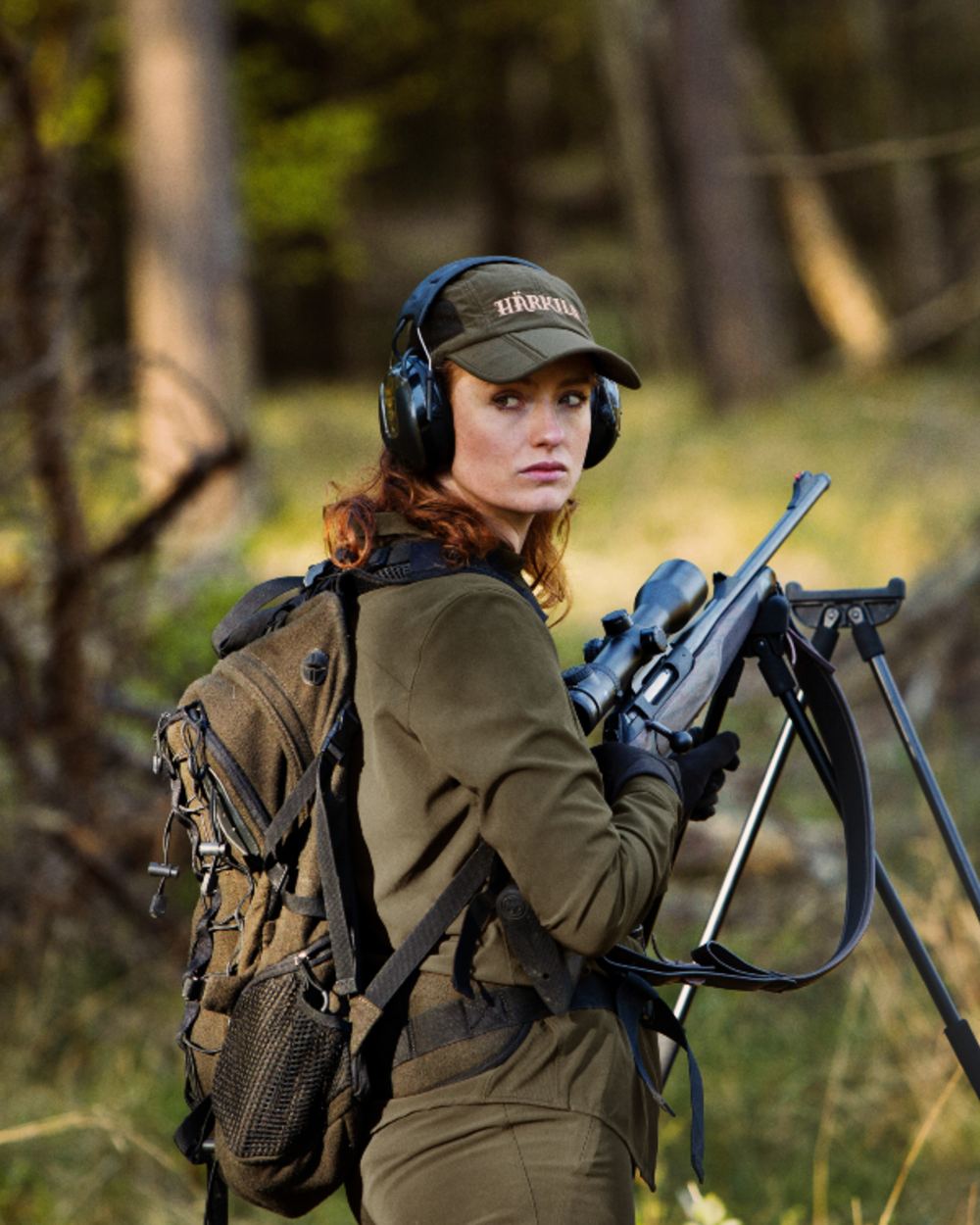 Willow Green Coloured Harkila Womens Herlet Tech Shirt on forest background 