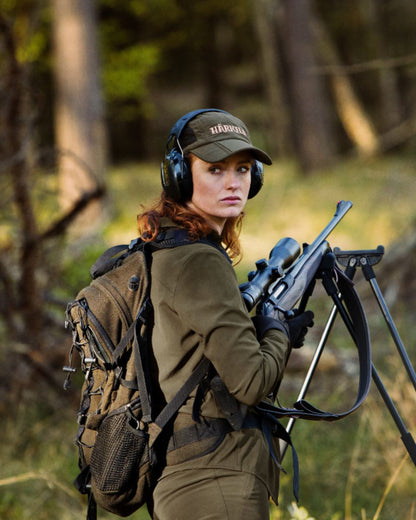 Willow Green Coloured Harkila Womens Herlet Tech Shirt on forest background 