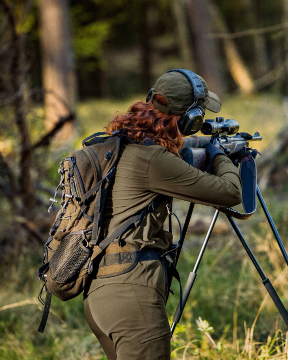 Willow Green Coloured Harkila Womens Herlet Tech Shirt on forest background 