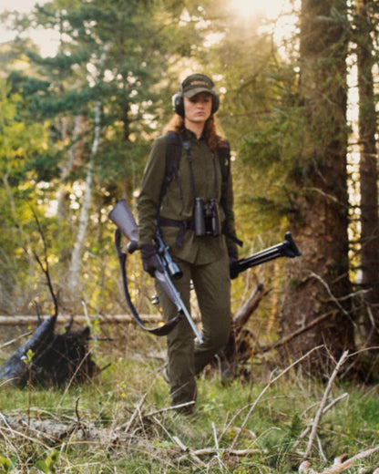 Willow Green Coloured Harkila Womens Herlet Tech Shirt on forest background 