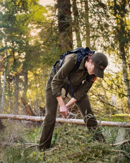 Willow Green Coloured Harkila Womens Herlet Tech Shirt on forest background 