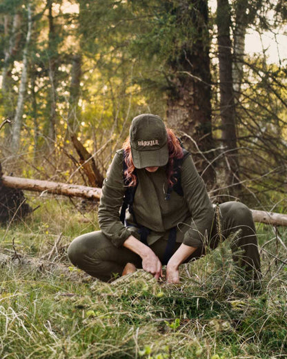 Willow Green Coloured Harkila Womens Herlet Tech Shirt on forest background 