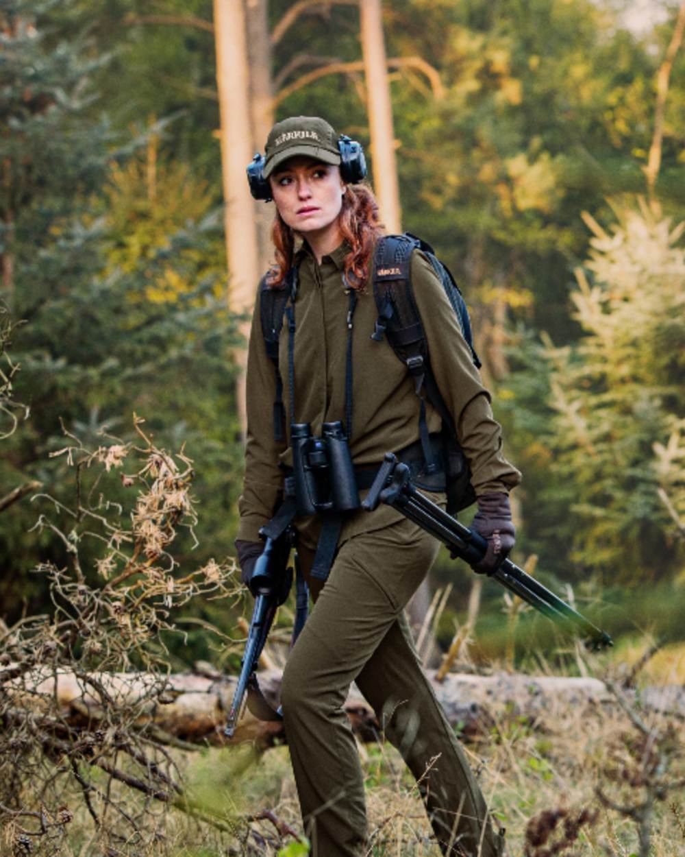 Willow Green Coloured Harkila Womens Herlet Tech Shirt on forest background 